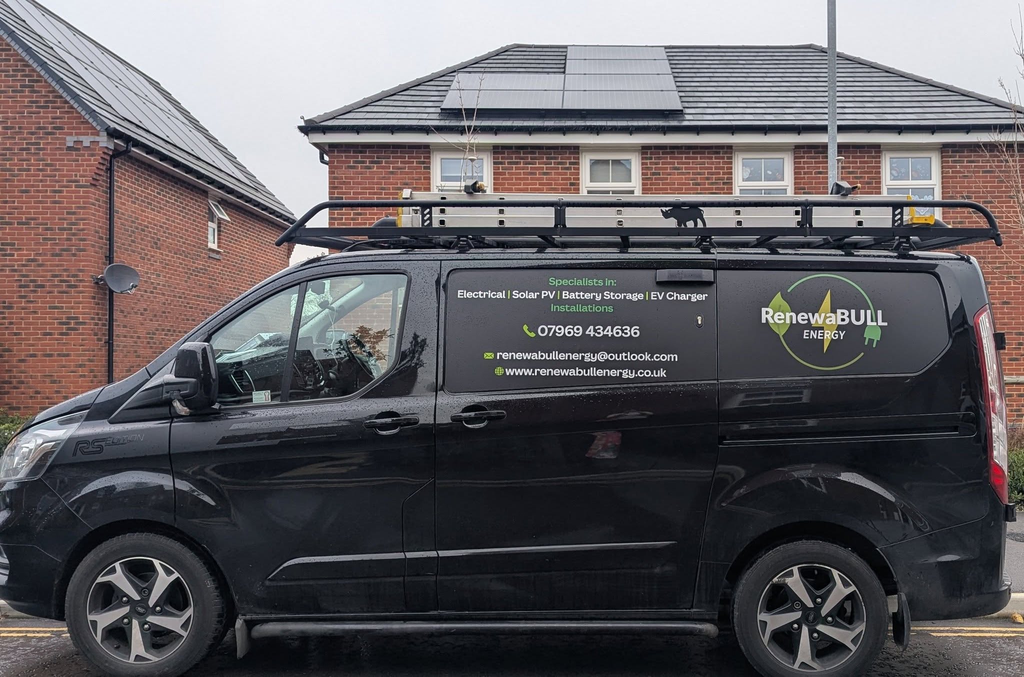 A RenewaBULL Energy van parked outside a brick home with solar panels on its roof.